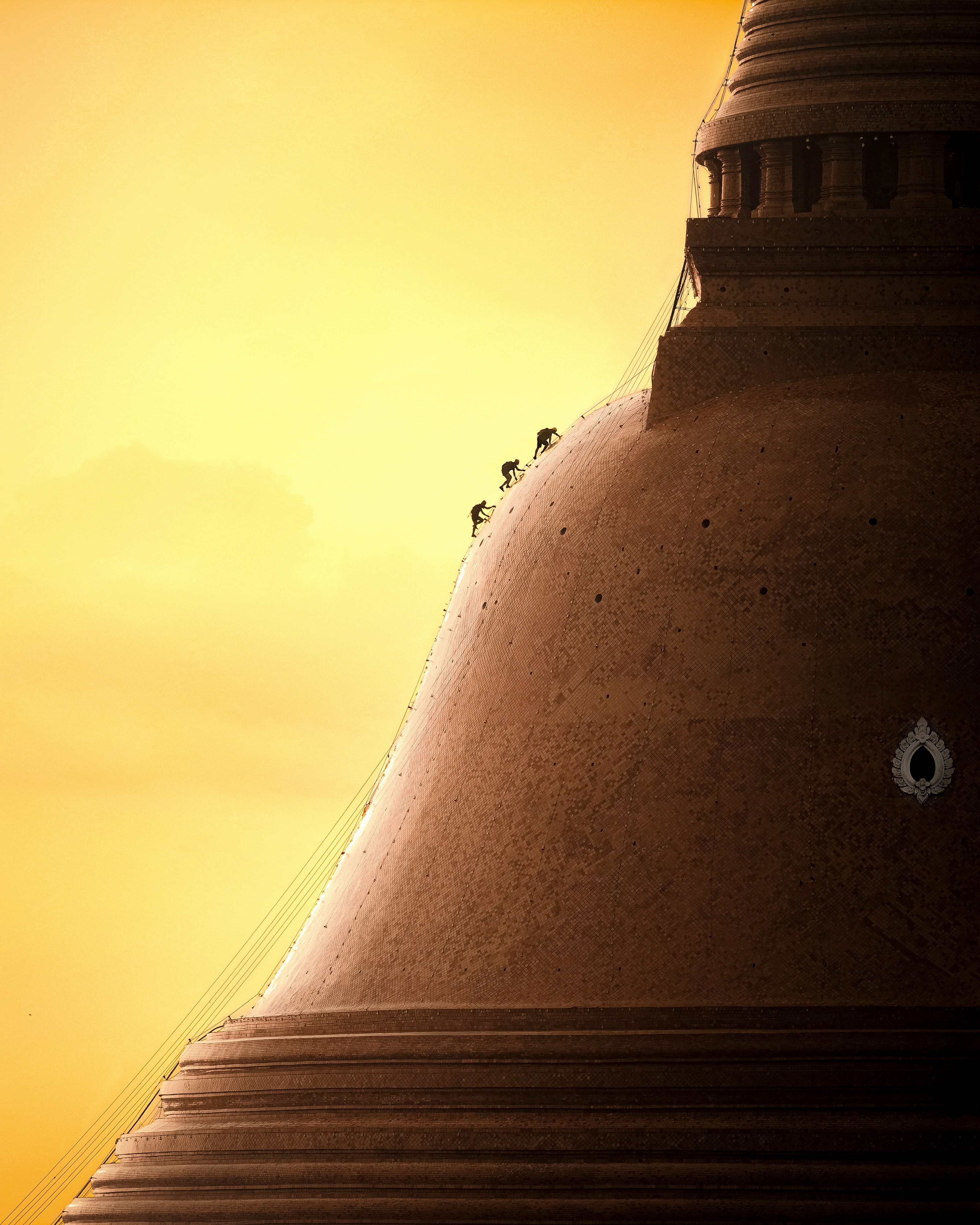 Close-up of a stupa against a golden sky